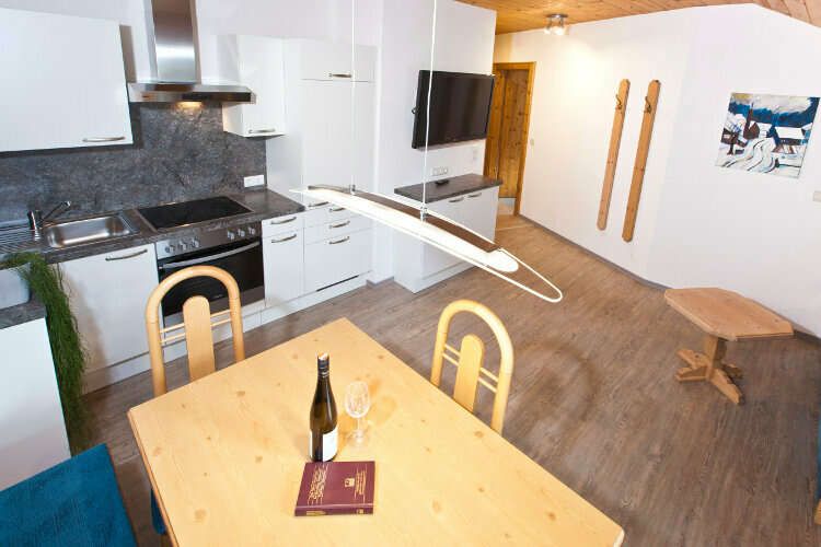  Living room with kitchen in apartment 4 holiday home Auer