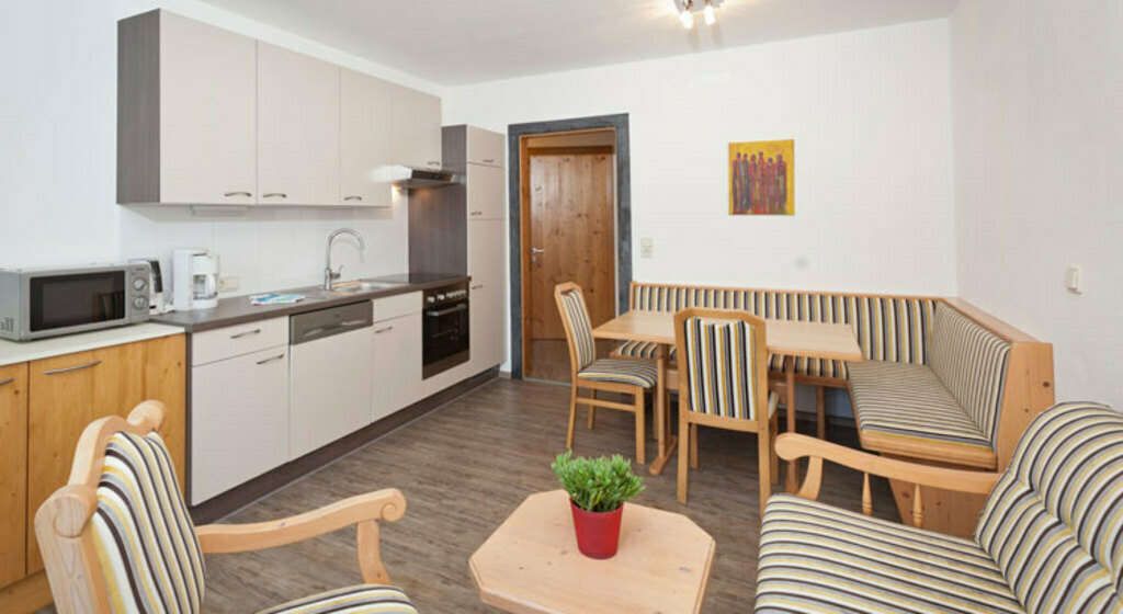 Living-dining area in apartment 1 in the Auer holiday home